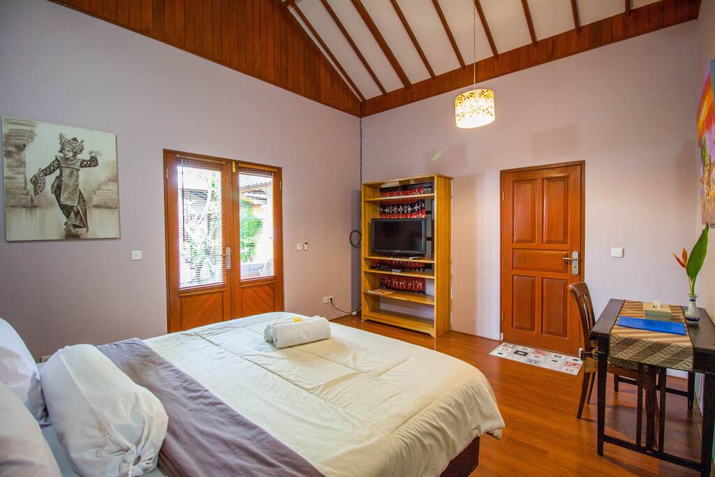 Bali room is complete with writing desk and Tv