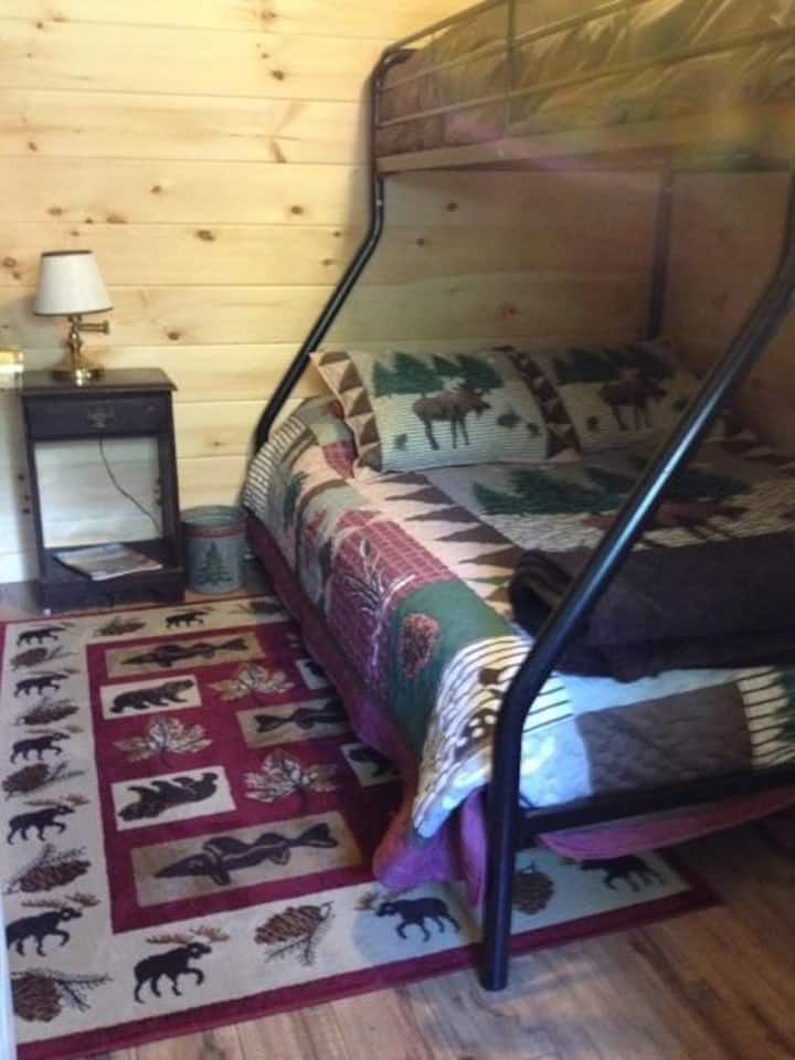 Back bedroom has a full size bed and single bunk on top