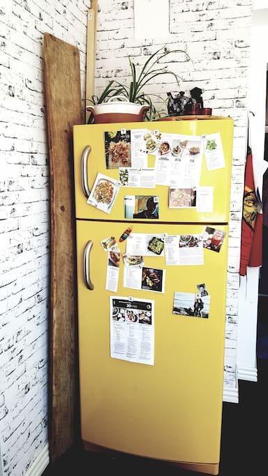 Full-size funny yellow retro fridge and freezer at your disposal