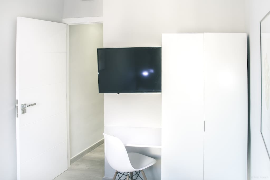 TV with HDMI and desk in your bedroom.