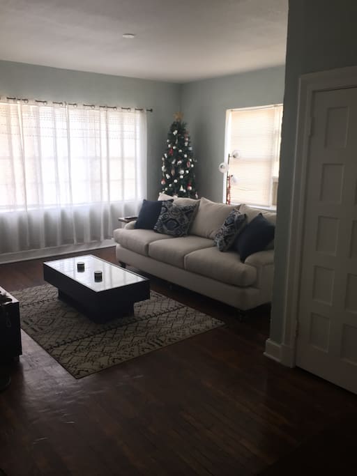 Plenty of natural light in the living room. View from kitchen.