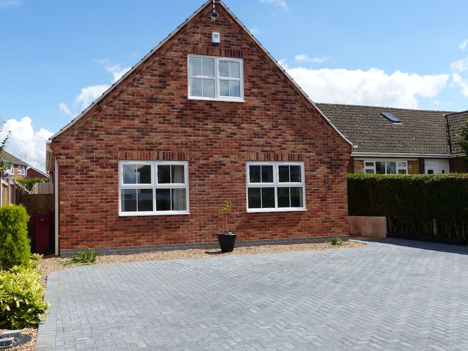 Front of property. large parking area suitable for at least 3 cars or a large van.