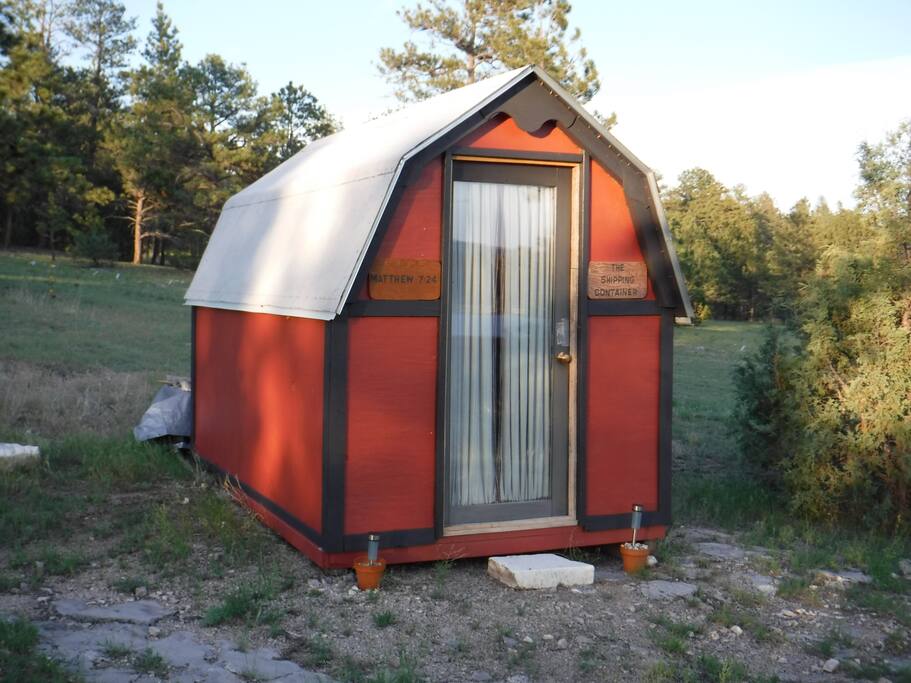 Really made from a shipping container, this rustic little cabin's interior dimensions are only 7 ft X 12 ft!