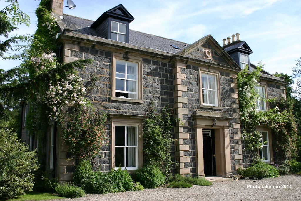 Front of house with roses out