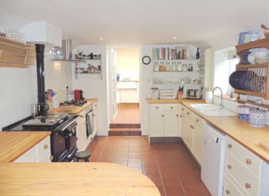 Kitchen with Rayburn and electric cooker with gas hob