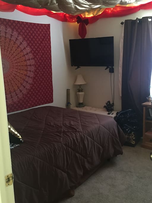 Wall mounted TV that is connected to Apple TV and Chromecast