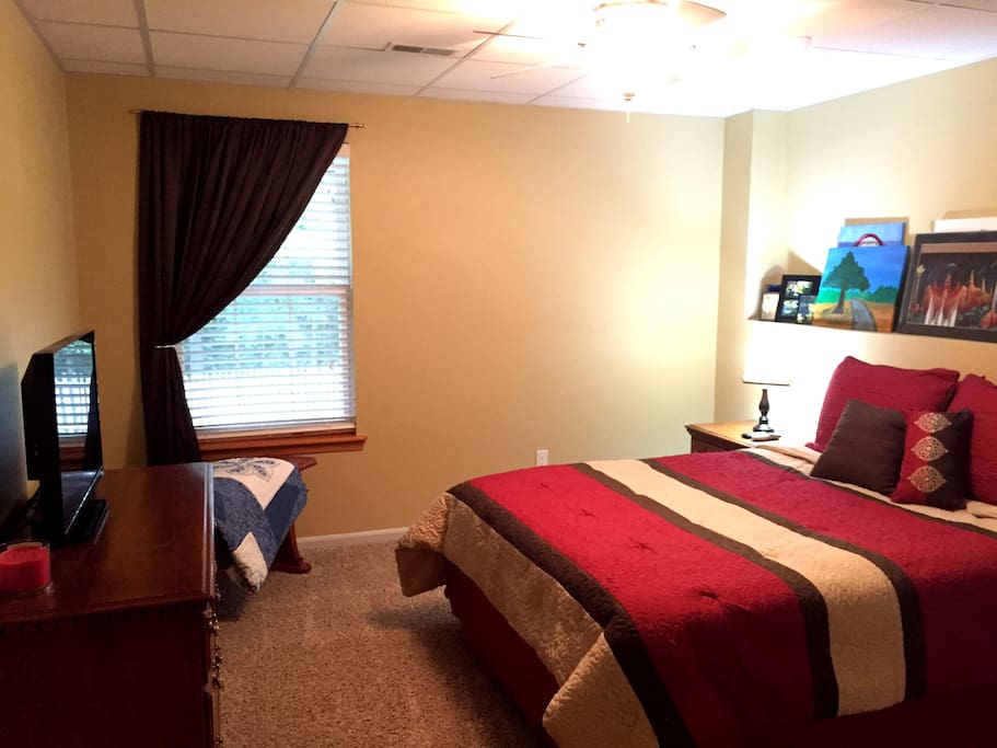 Bedroom 1: sheets provided, drawers available, and tv with DirecTV