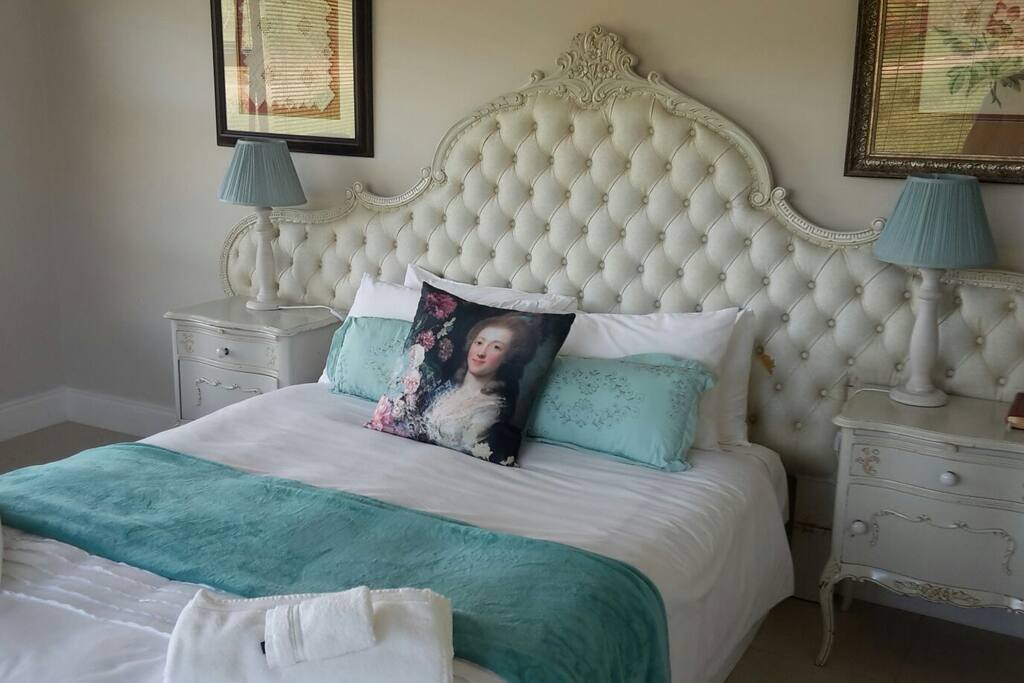 Spacious bedroom with Queen-size bed and dressing table