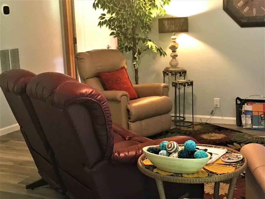 Sit in the leather love seat double recliner or in one of 2 additional leather recliners and watch the 55in. HD flat screen TV!!