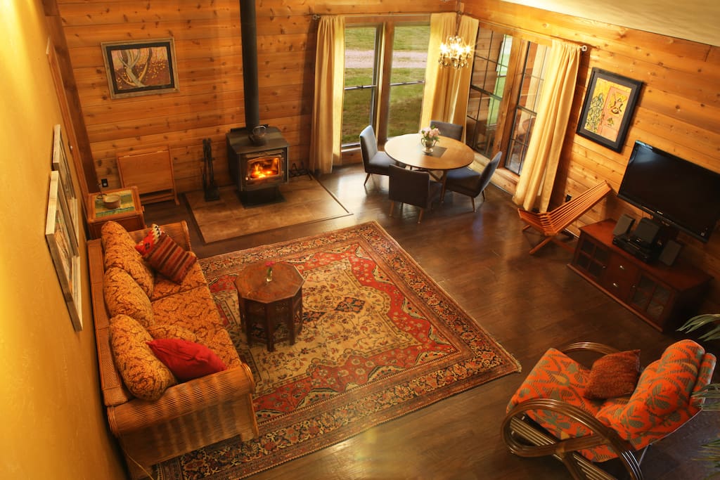 Taken from the loft above the kitchen, you can see how spacious the room is - perfect for families or a getaway with friends! The robust entertainment system includes satellite cable, a sound system, and an MP3 player with auxiliary cable.