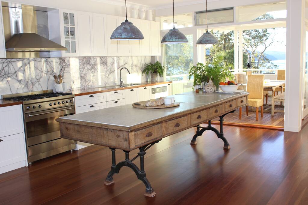 Unique kitchen, French 1850's table, serves straight to north-facing terrace.