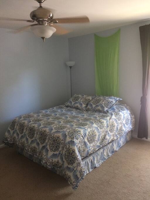 The bedroom has a nice ceiling fan.