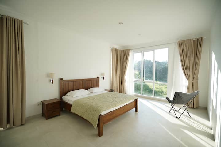 The second bedroom with a mountain view.