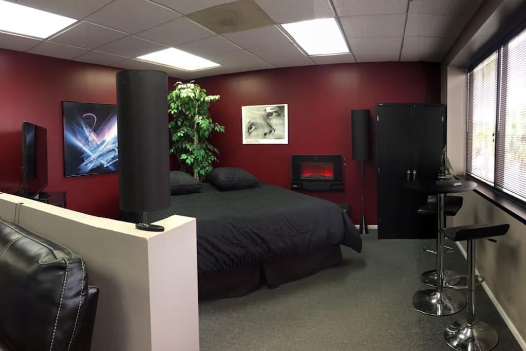 The Loft Area is Open Concept and Features a King Size Bed, 45" Smart TV and Electric Fireplace