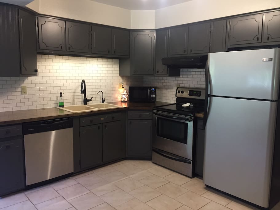 Full, well lit kitchen with newer appliances for all your cooking needs.