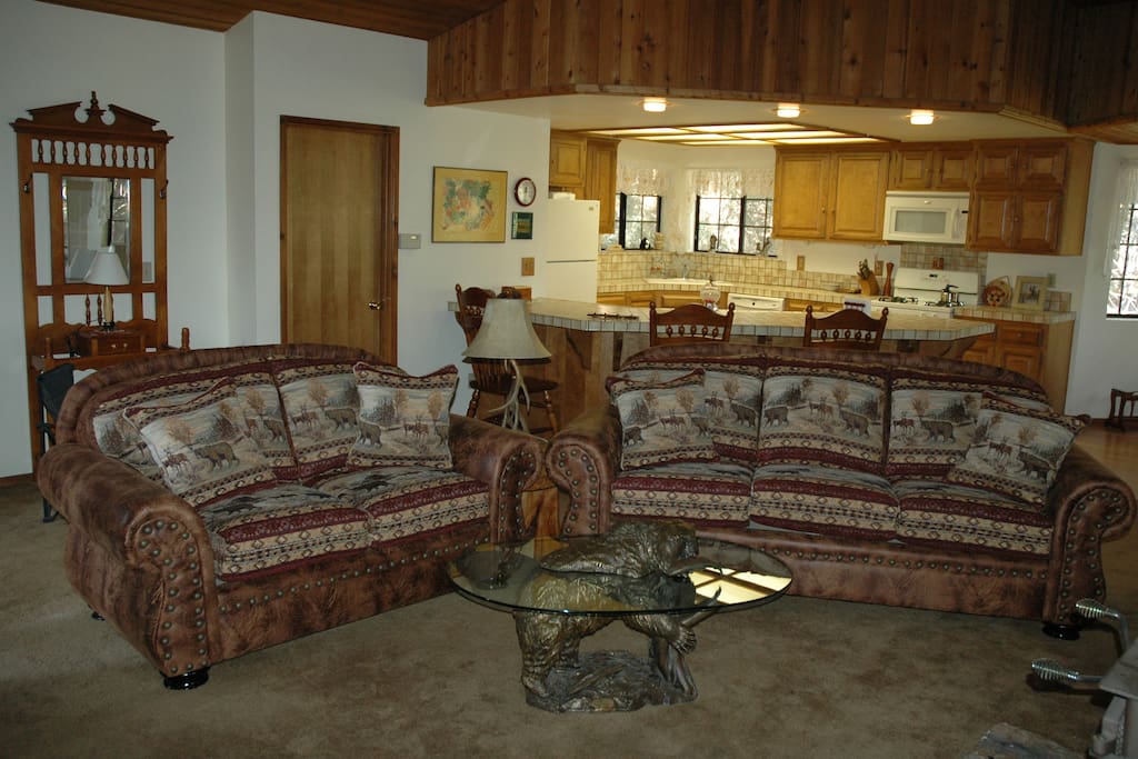 Family room with the kitchen in the back ground.