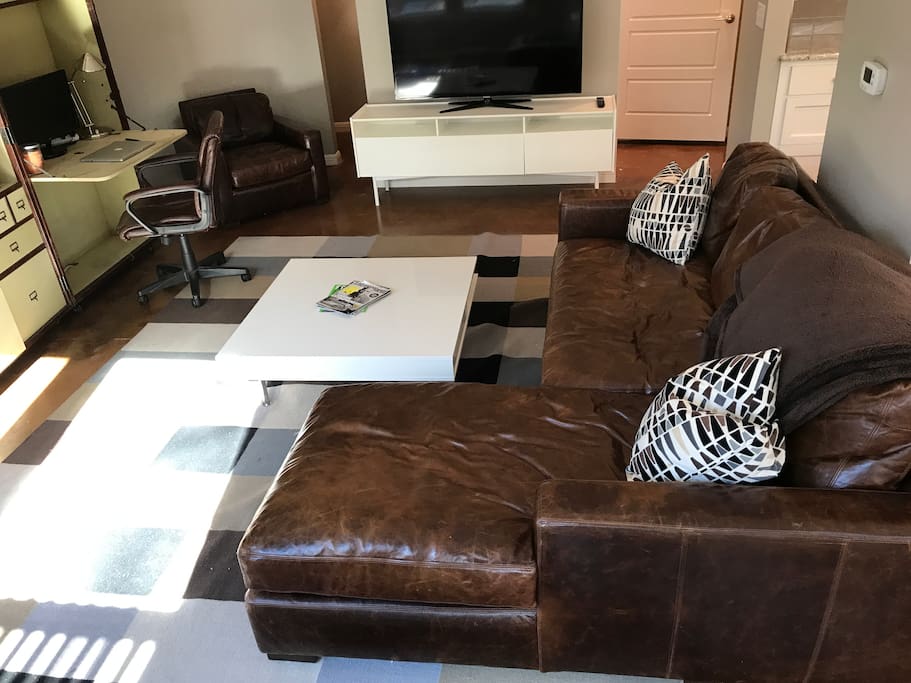 48" inch deep antique whiskey leather Restoration Hardware couch stuffed with duck feathers. Relax, read, watch TV, or nap (careful, you'll sleep way longer than you planned!