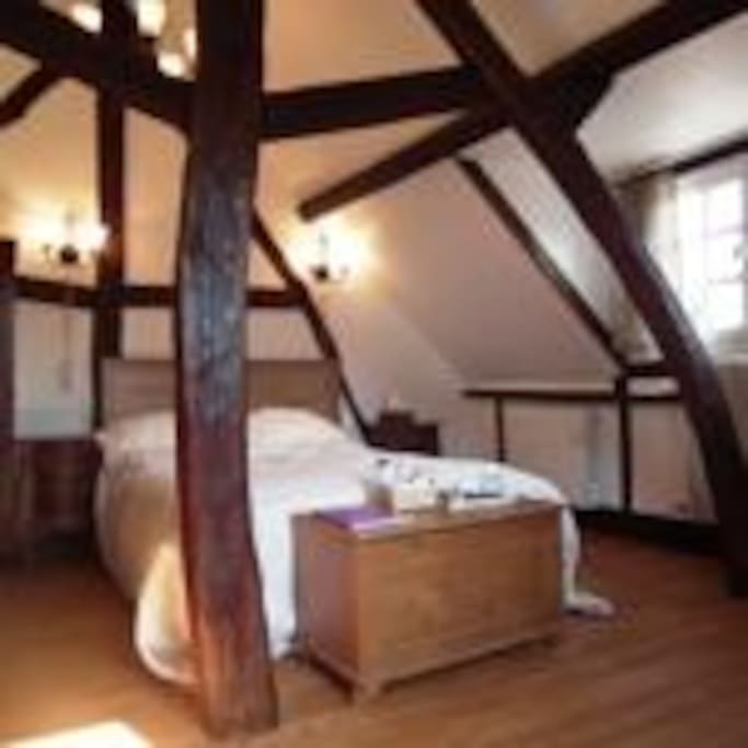 View of bed from the bath area