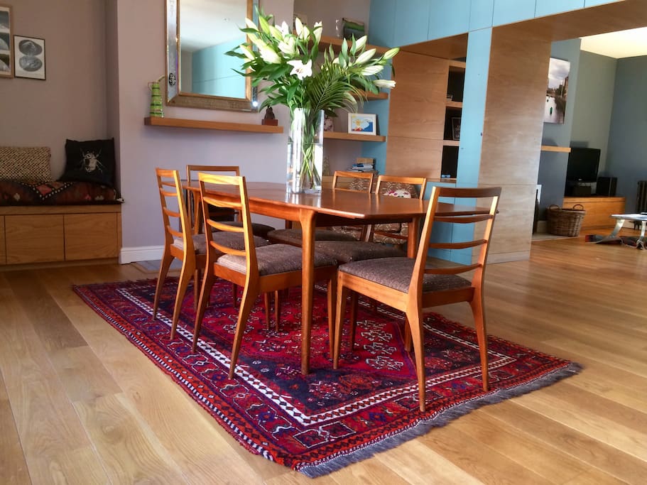 Our mid-century Danish dining table seats 6 and if you're too exhausted to cook grab some take-out from the wonderful food hall across the road.