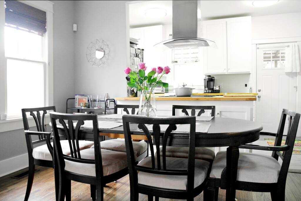 Dining room that opens to both the kitchen and living room.