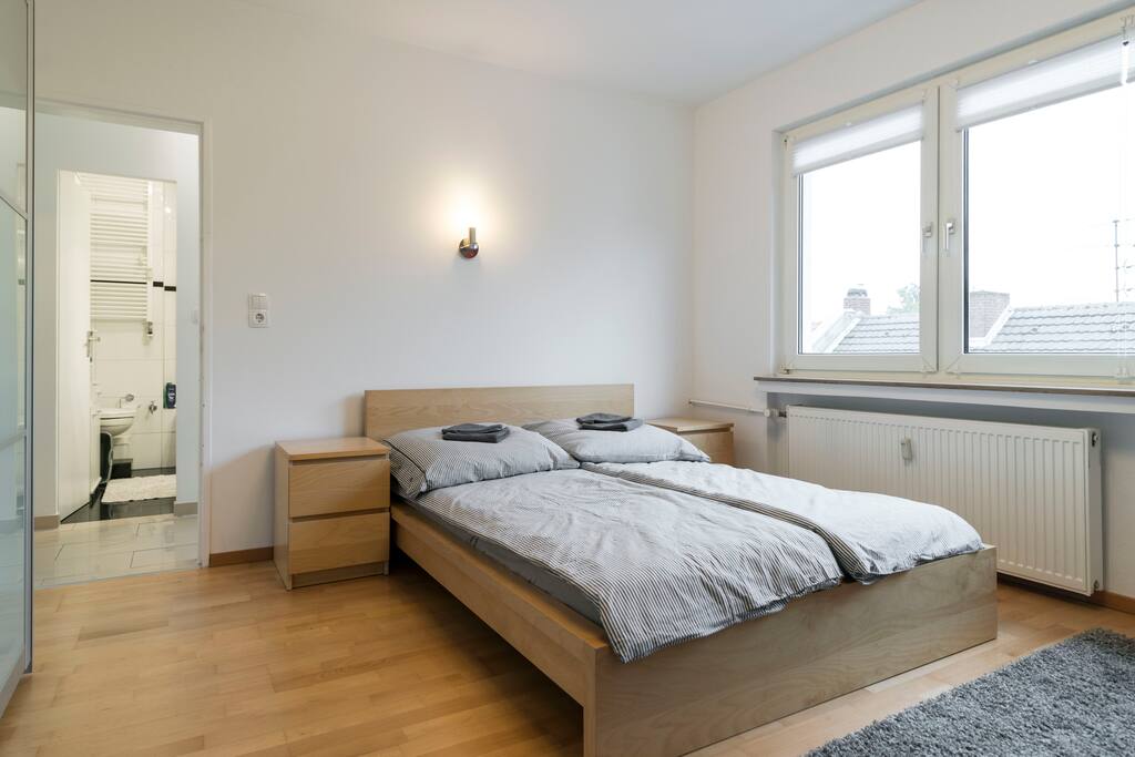 Double bed in the first sleeping room.