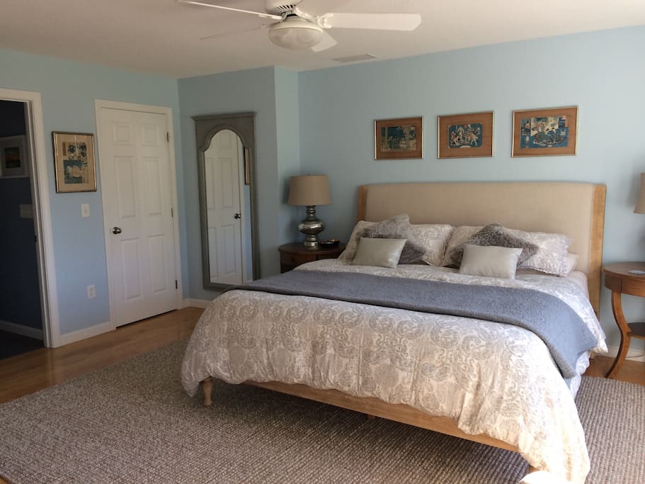 The master bedroom is decorated with vintage Japanese woodblock prints and other original art.
