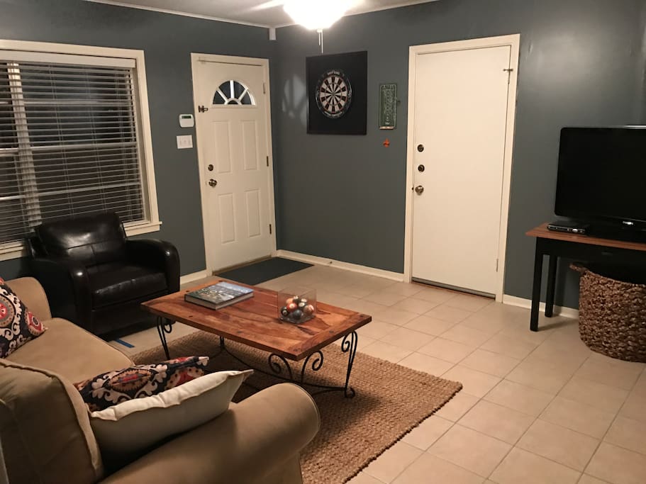 Second living area with TV and dart board.