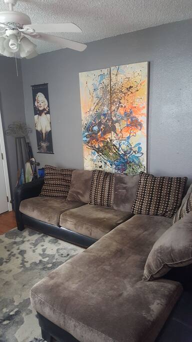 Comfy sectional sofa & skate board for use.