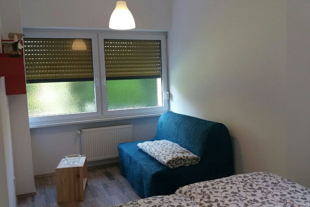 The bedroom from another perspective with a couch-bed