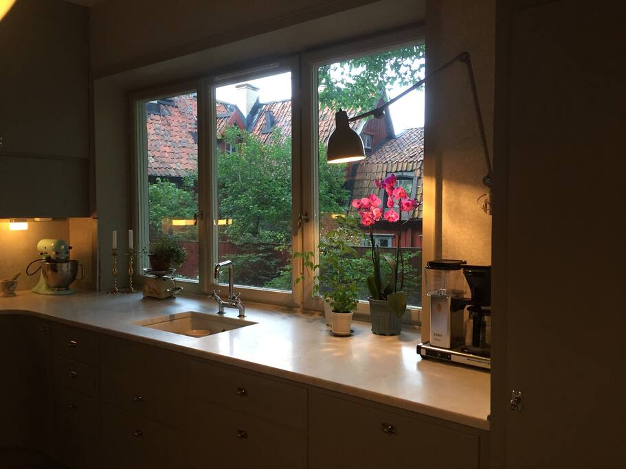 Kitchen view over quiet little park and neighbour houses.