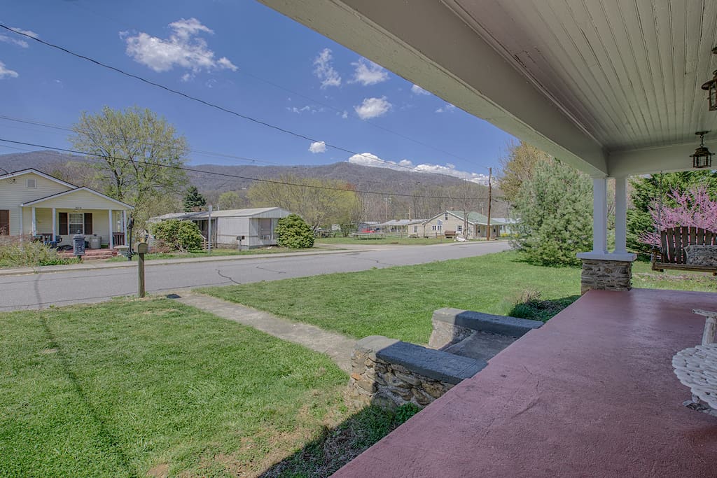 Front porch swing with mountain views facing east