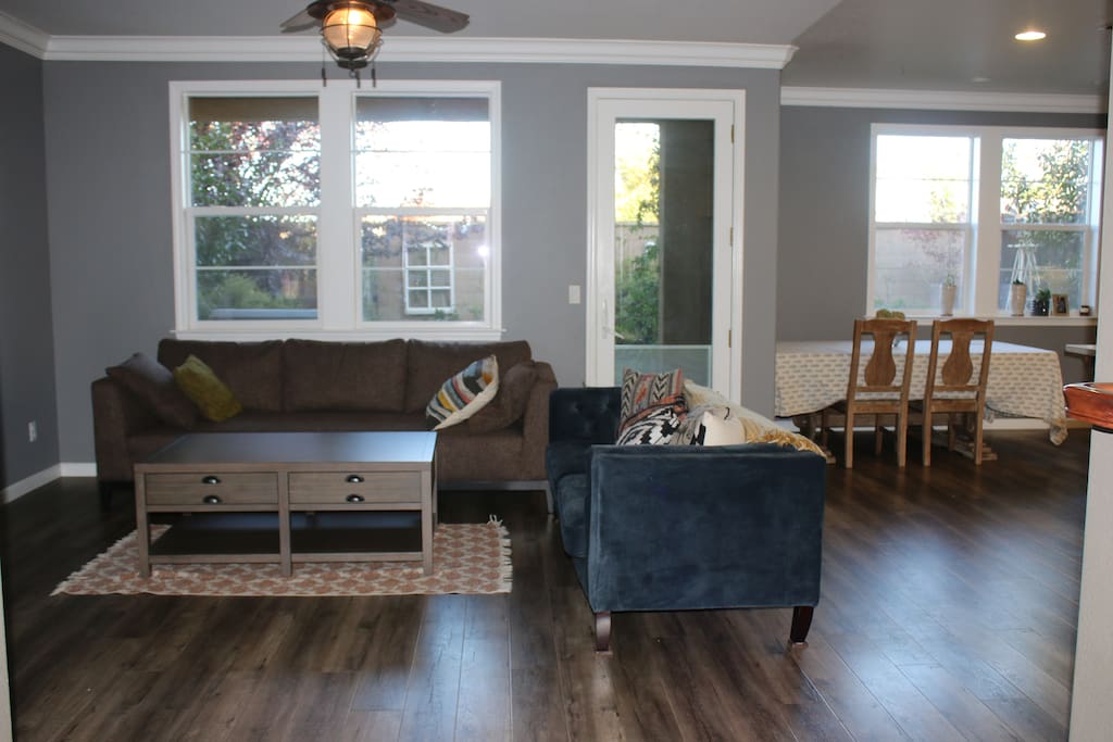 Living room with a kitchen dining table that seats 6-8 people