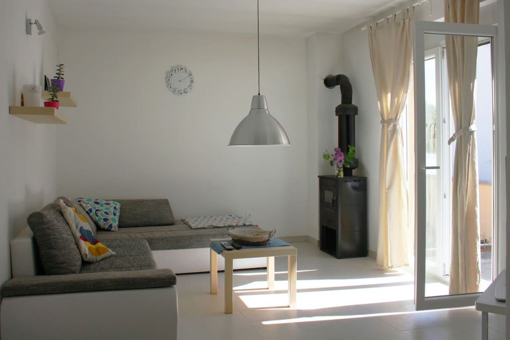 Luminous living area with outside terrace