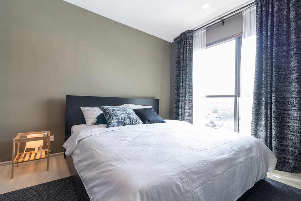 Luxurious king bed with private bath and spacious wardrobe