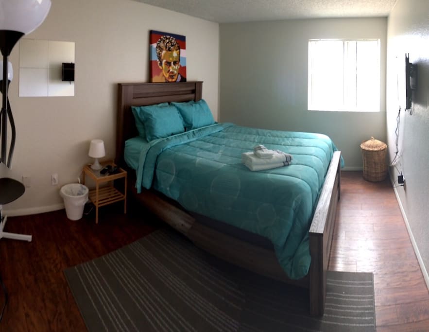 Upstairs Bedroom #2. Queen bed. Flatscreen tv with cable. Closet, with hangers.