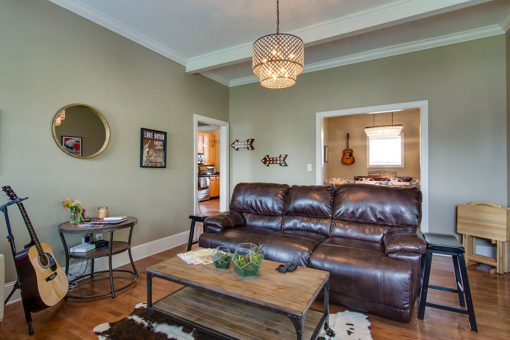 Super comfy and spacious living room with reclining sofa and internet-connected TV