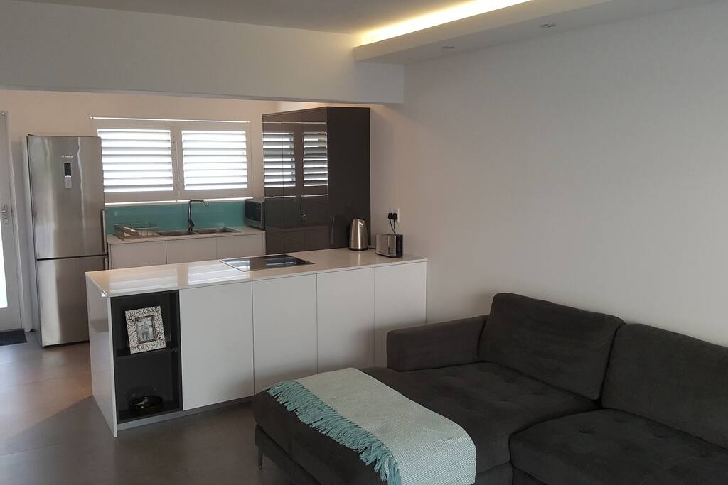 Lounge with view into kitchen.