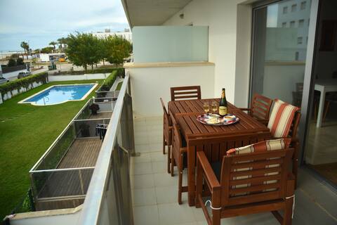 Great apartment with pool and garage.