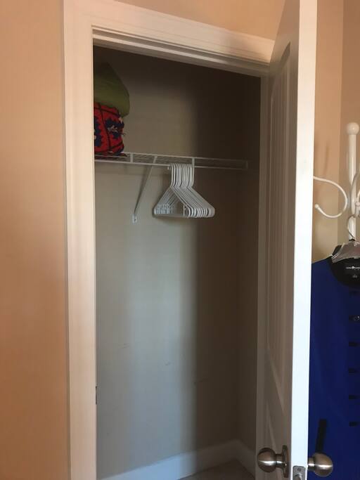 Guest closet with hangers and extra blankets exclusively for your use