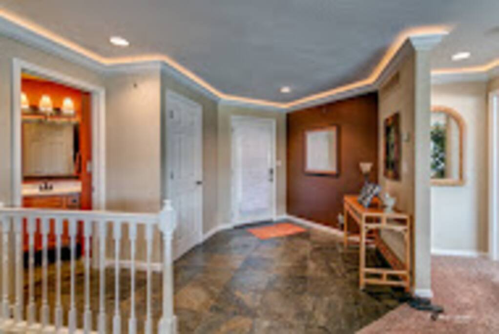 Guest bath and stairs to lower level living space