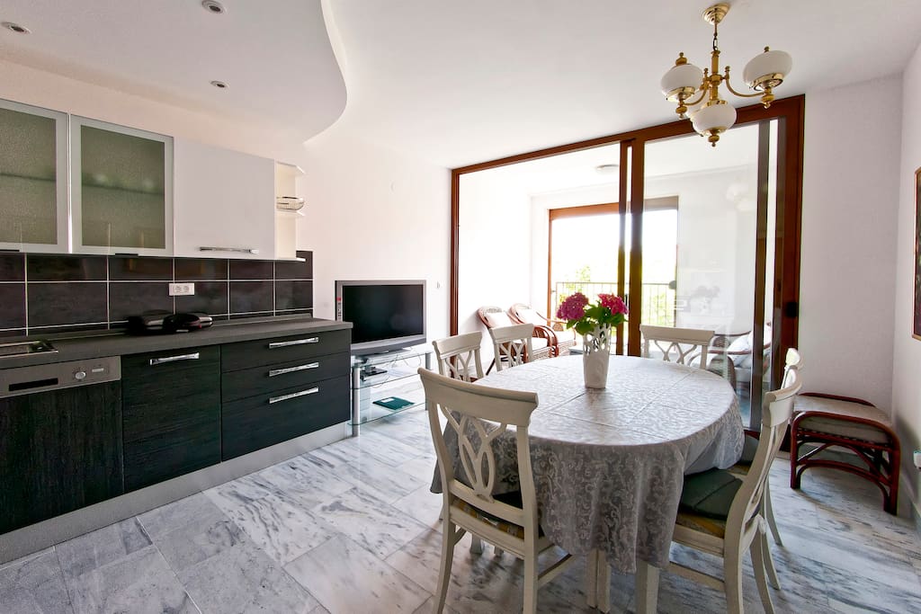 dining room and kitchen with loggia