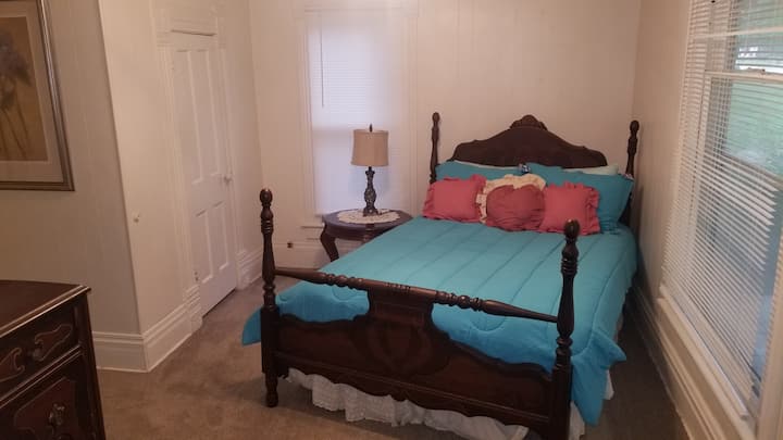 The master bedroom suite includes the home's original master bedroom, the front sitting room and a full bath.