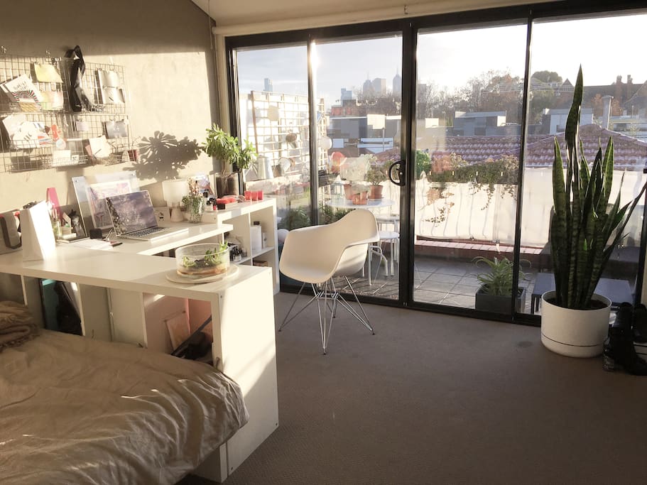 Sunny bedroom with view on the city