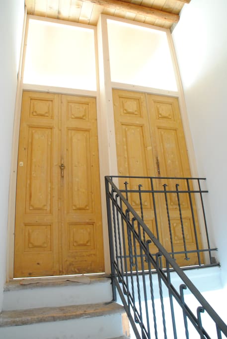 staircase to main entry of the unit
