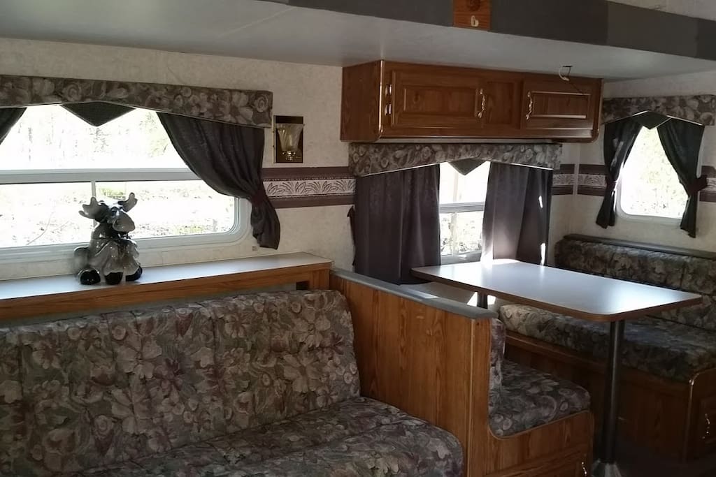 There's also a large booth type dining table that makes another bed.