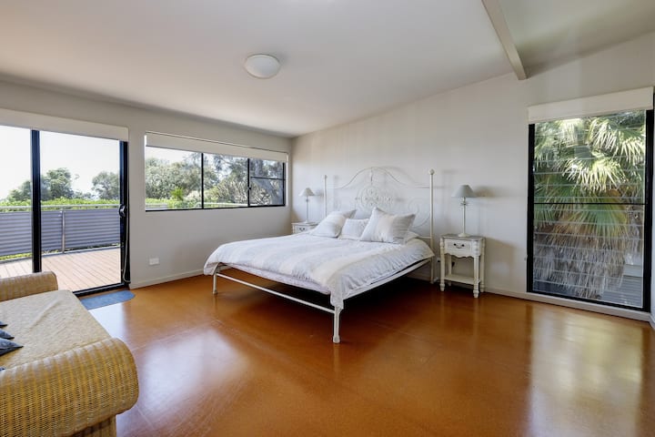 The Master bedroom has an ensuite and looks north over the ocean towards Port Macquarie.