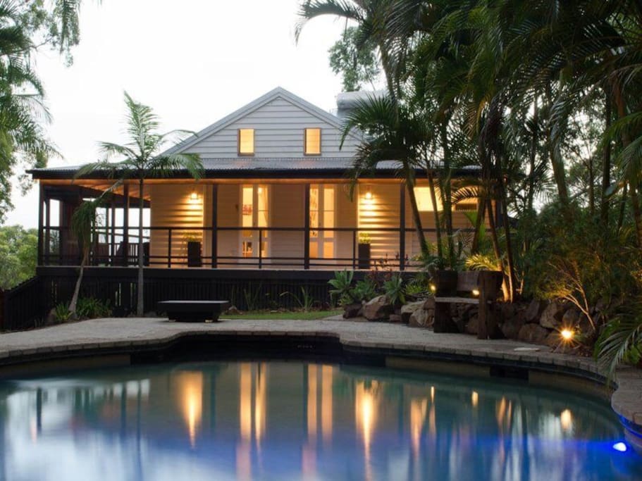 Your room with view of pool at dusk