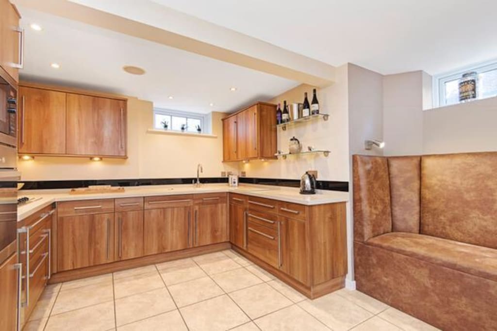 Spacious kitchen with new leather booth