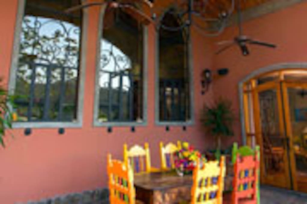 Dining Patio with custom windows in the kitchen.