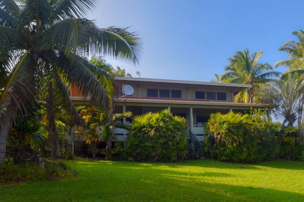 A large, private yard surrounds the home, planted with tropical flowers and fruits for your enjoyment.